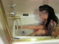 Busty starlet Christy Mack takes a bath