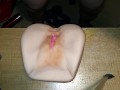 Male sex toy with triple cumshot.