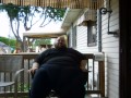 Fat men sitting outside happy