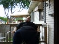Fat men sitting outside happy