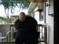 Fat men sitting outside happy