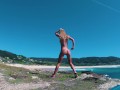 Stunning nudist girl sexy dancing naked on the coast. Perfect body