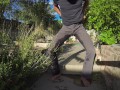 Pissing grey jeans in a huge flood outdoors