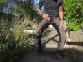 Pissing grey jeans in a huge flood outdoors
