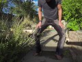 Pissing grey jeans in a huge flood outdoors
