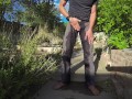 Pissing grey jeans in a huge flood outdoors