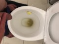 Pissing in toilet