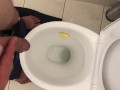 Pissing in toilet