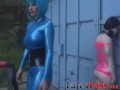 Latex Mistress Aradia restrains young dykes before toying