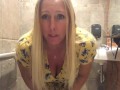 Horny MILF vibrates pussy in bar restroom!