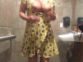 Horny MILF vibrates pussy in bar restroom!