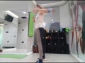 Cute blonde doing her warmup at the gym