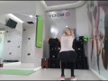 Cute blonde doing her warmup at the gym