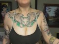 CHUBBY TATTOOED GIRL DOING BICEP CURLS