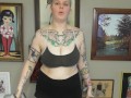 CHUBBY TATTOOED GIRL DOING BICEP CURLS
