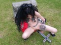 Blasphemic satanic whore fucking her pussy and ass in an old cemetary