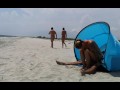 Fit couple having sex on the beach while watching other couple. WetKelly
