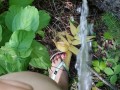 Girl In Swim Suit Pees On Fallen Tree By River