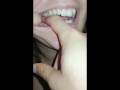 girl biting hard finger