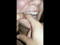 girl biting hard finger