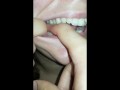 girl biting hard finger