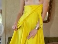 Yellow dress and heels, slow strip tease. 