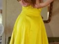 Yellow dress and heels, slow strip tease. 