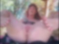 Redhead fingers pussy, has to stop when caught by the gardner