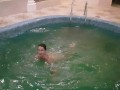 Girl jumps naked into the pool
