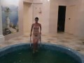 Girl jumps naked into the pool