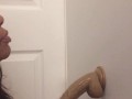 Sexy Ebony teen sucking and gagging big dildo