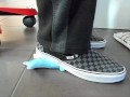 Male shoeplay and stomping stuff at home in Nikes, Vans, blue stiped socks