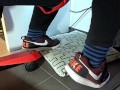 Male shoeplay and stomping stuff at home in Nikes, Vans, blue stiped socks