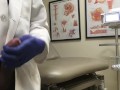 Doctor Relieving Stress In Hospital Exam Room