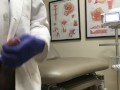 Doctor Relieving Stress In Hospital Exam Room