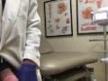 Doctor Relieving Stress In Hospital Exam Room