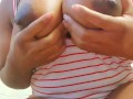   and lotioning my big ebony tits in tanktop