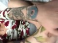 Flirty tattooed redhead shows off ass and feet 