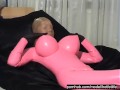 Girl In Pink Latex Catsuit With Big Boobs And Shiny Encasement Pantyhose