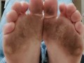 Wiggling and scrunching my big dirty stained feet in front of you