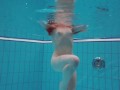 Half euro babe taking swimming classes in public pool