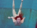 Half euro babe taking swimming classes in public pool