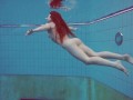 Half euro babe taking swimming classes in public pool