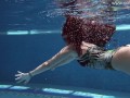 Brunette Spanish Diana Rius swimming topless