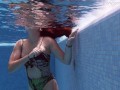 Brunette Spanish Diana Rius swimming topless