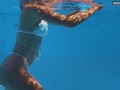 Being naked underwater brings her sexual pleasures