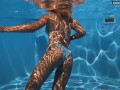 Being naked underwater brings her sexual pleasures