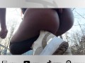 Slutty Ebony shakes ass and shows her holes in forest near public bridge
