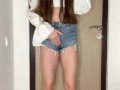 Sexy brunette pees in her denim shorts because her bladder is about to burst