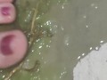 Smashing juicy grapes under my big toes close up under and side pov